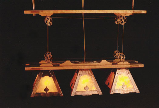 A copper, cherry and mica dining table chandilier